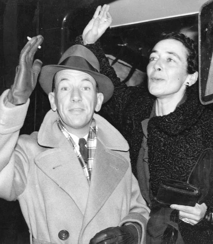 Stylishly attired for travel, Noël Coward and his longtime production designer, Gladys Calthrop, depart Waterloo on the boat train bound for New York, 1936. Credit: Courtesy of The Cinema Museum